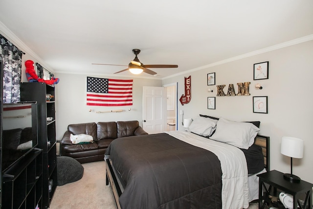 carpeted bedroom with ornamental molding and ceiling fan