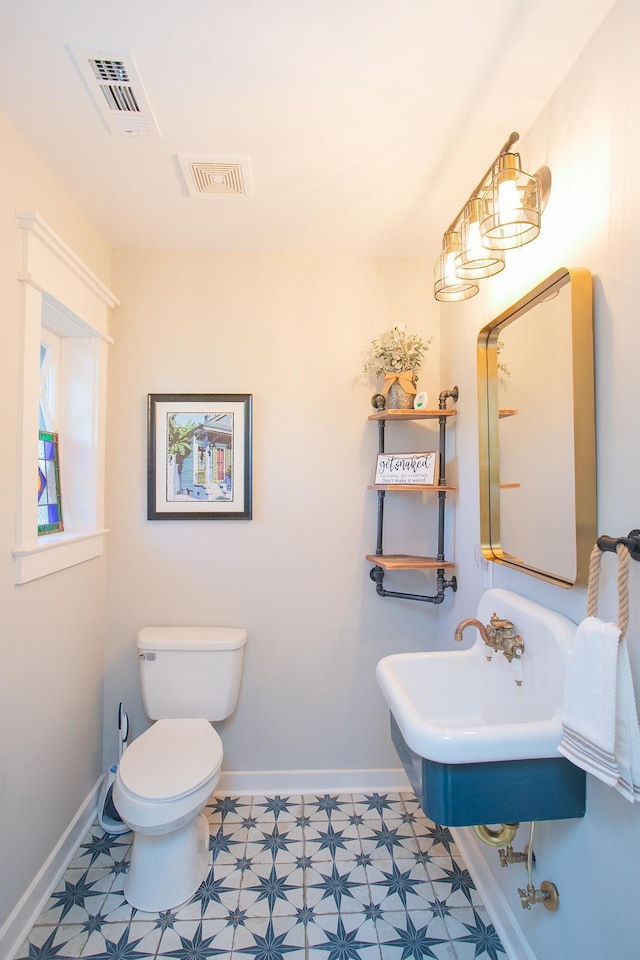 bathroom featuring sink and toilet