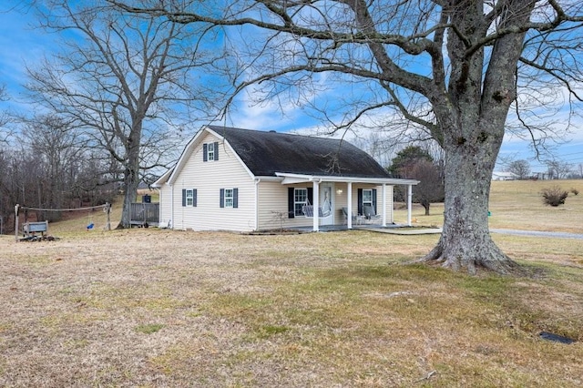 view of front facade with a front yard and a porch