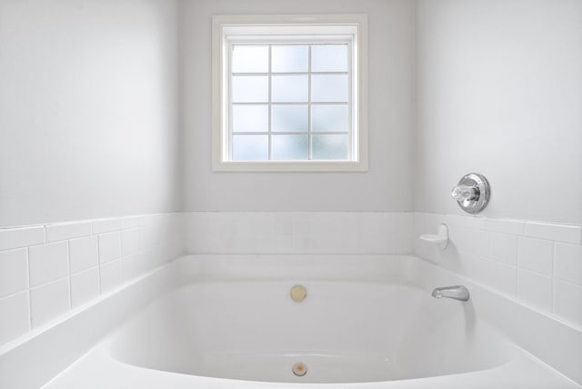 bathroom featuring a tub