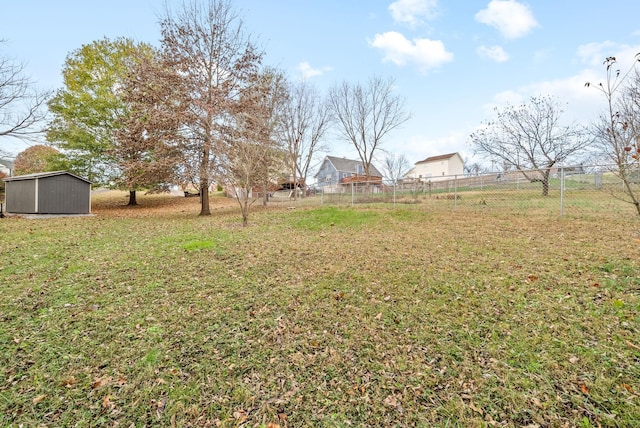 view of yard with a rural view and a storage unit