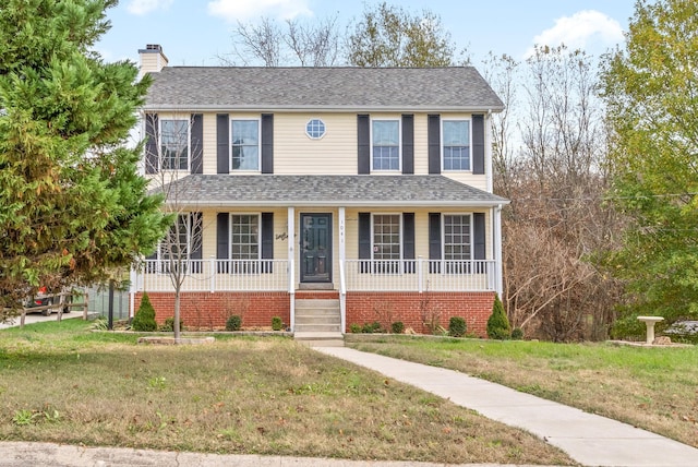 view of front of house featuring a porch and a front lawn