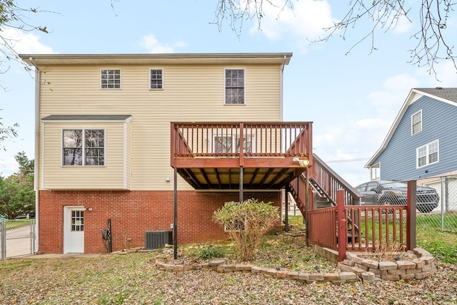 rear view of house featuring a deck and central air condition unit