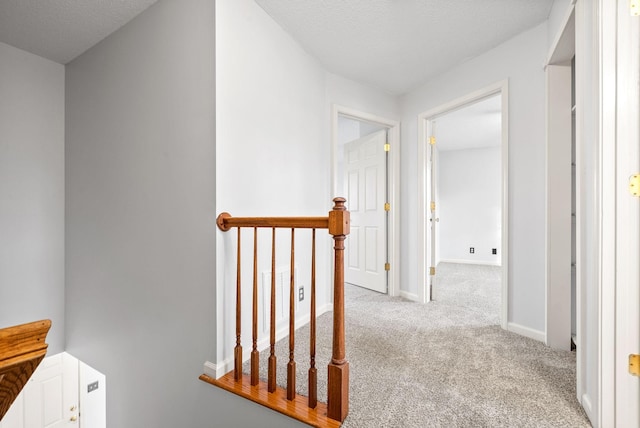 corridor featuring light carpet