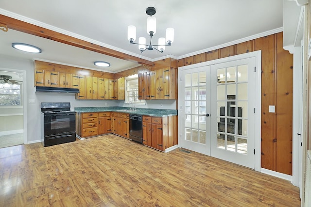 kitchen with sink, light hardwood / wood-style flooring, ornamental molding, black appliances, and french doors