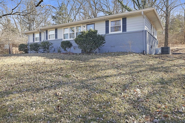 ranch-style home featuring central air condition unit