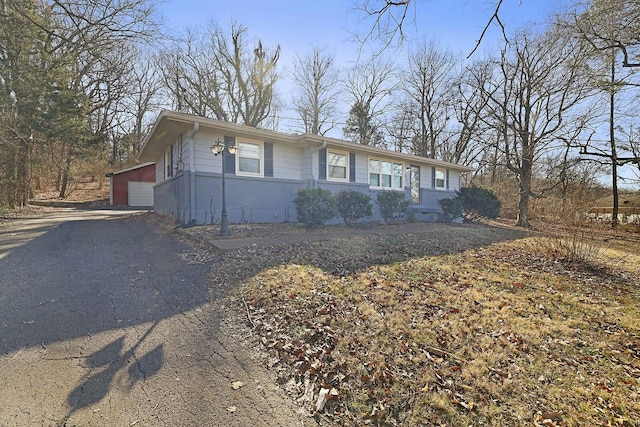 single story home with a garage