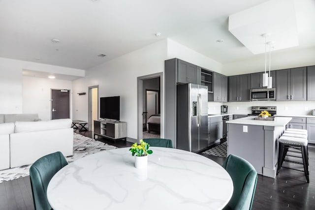 dining space with dark hardwood / wood-style floors