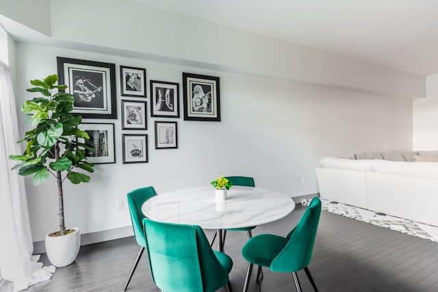 dining area with dark wood-type flooring