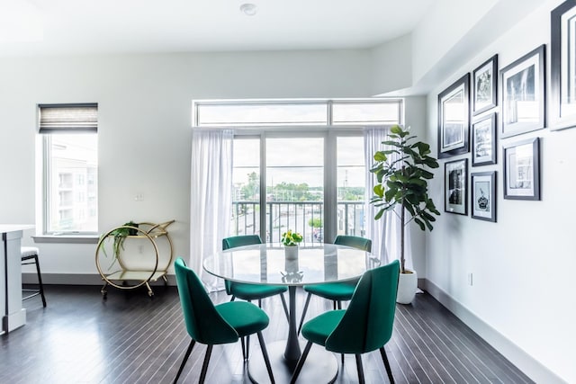 dining space with dark wood-type flooring