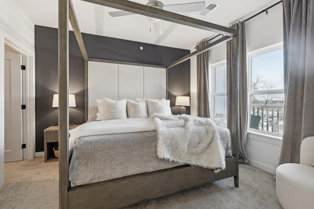 bedroom featuring ceiling fan and light carpet