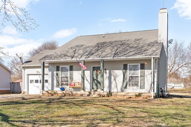 view of front of property featuring a garage and a front yard