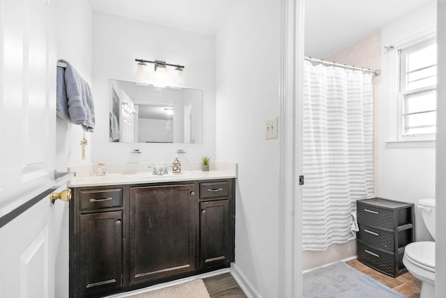 full bathroom with vanity, toilet, and shower / bath combo with shower curtain