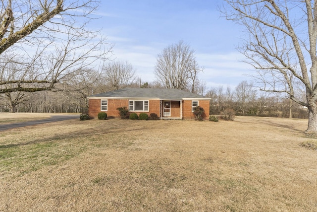 ranch-style home with a front yard