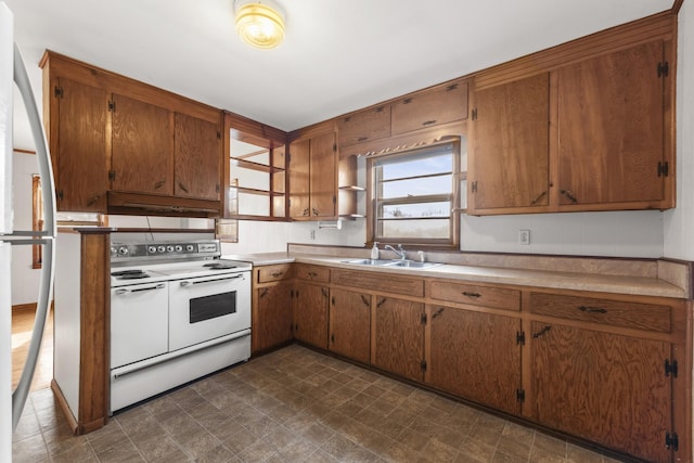 kitchen featuring double oven range and sink