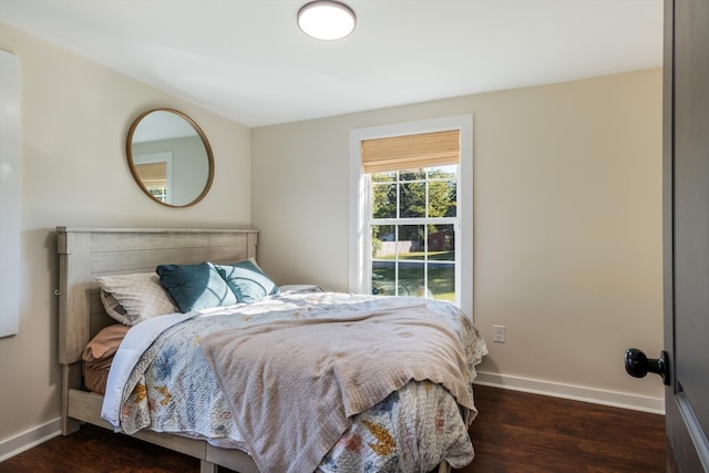 bedroom featuring dark hardwood / wood-style flooring