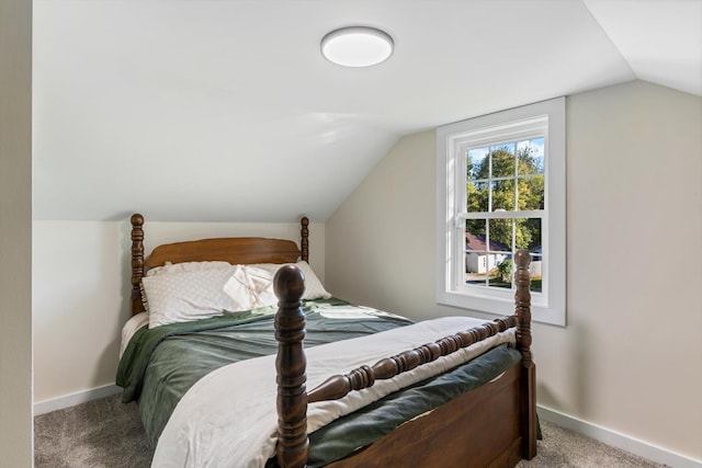 carpeted bedroom featuring vaulted ceiling