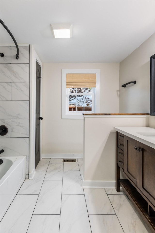 bathroom featuring vanity and tub / shower combination