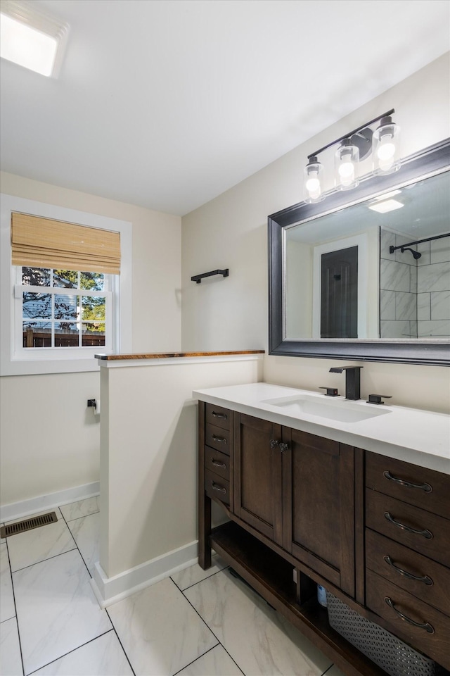 bathroom featuring vanity and walk in shower