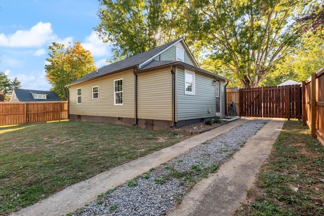 view of property exterior featuring a lawn