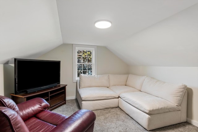 living room featuring vaulted ceiling and light carpet