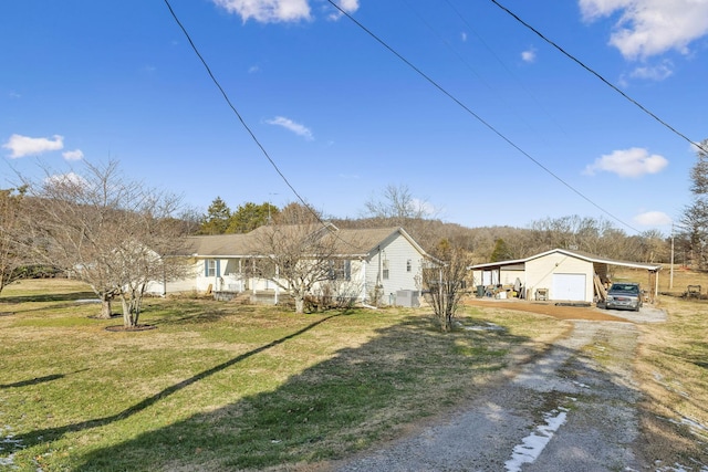 single story home with a carport and a front lawn