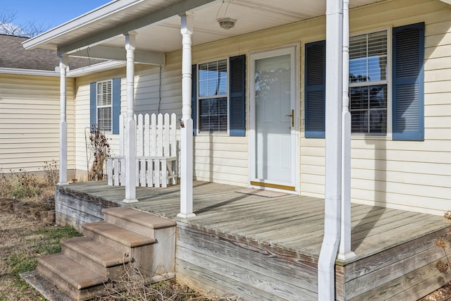 wooden terrace featuring covered porch