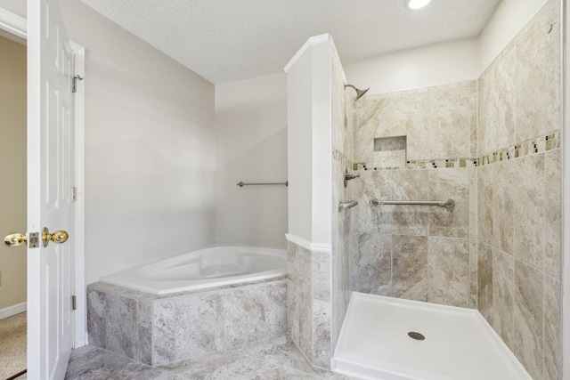 bathroom with shower with separate bathtub and a textured ceiling