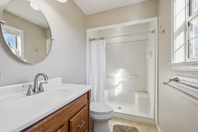 bathroom featuring vanity, curtained shower, tile patterned floors, and toilet