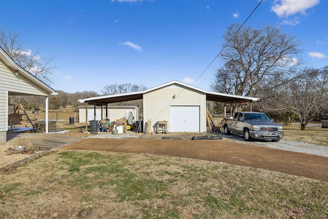 garage featuring a carport