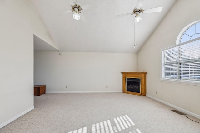 unfurnished living room with light carpet, lofted ceiling, and ceiling fan