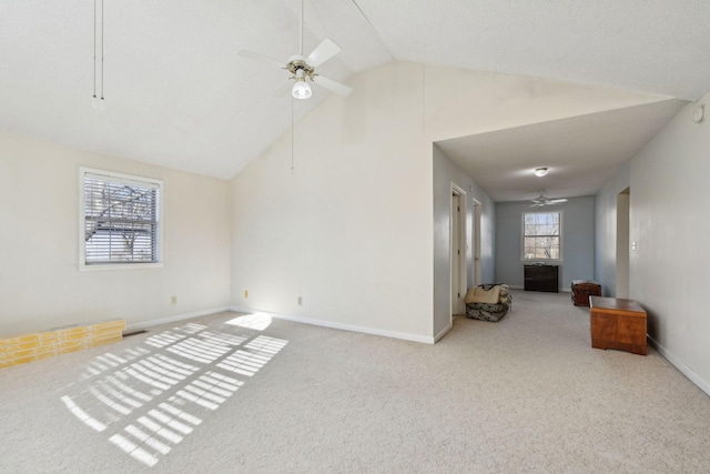 carpeted living room with lofted ceiling and ceiling fan