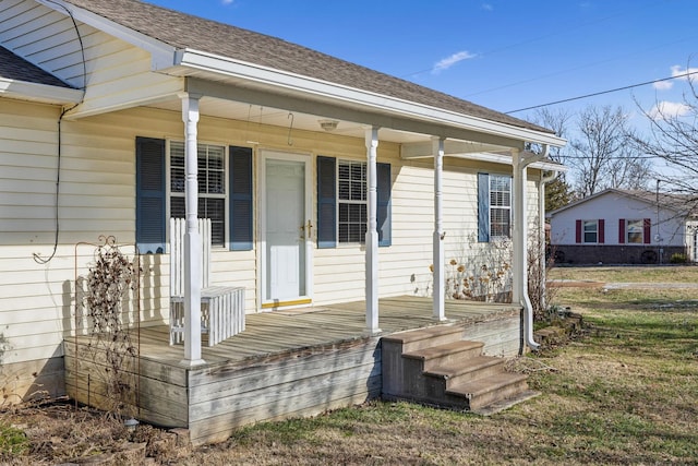 view of exterior entry with covered porch