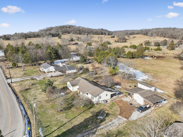 birds eye view of property with a rural view