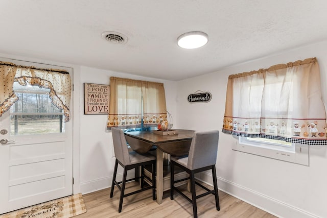 dining room featuring light hardwood / wood-style flooring