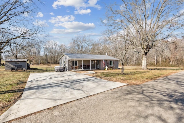 view of front of house featuring a front yard and covered porch