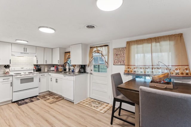 kitchen featuring sink, light wood-type flooring, white cabinets, white appliances, and backsplash