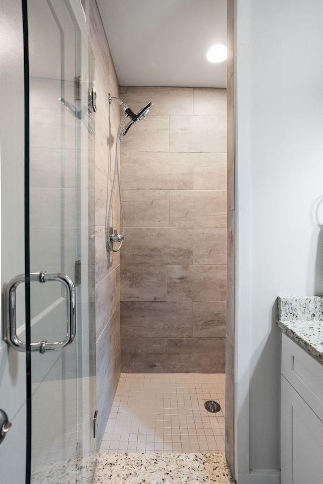 bathroom with vanity and an enclosed shower