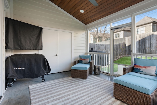 sunroom / solarium with vaulted ceiling and wood ceiling