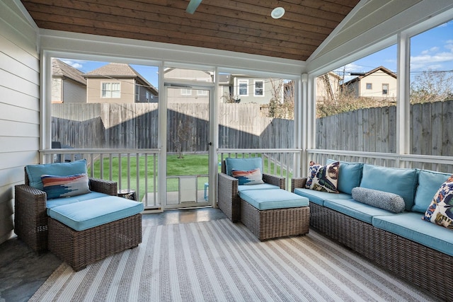 sunroom / solarium featuring lofted ceiling and wood ceiling