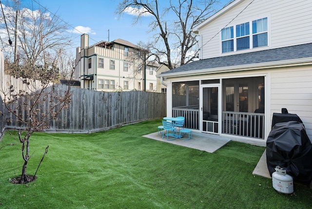 view of yard with a patio area and a sunroom