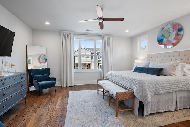 bedroom with dark wood-type flooring and ceiling fan