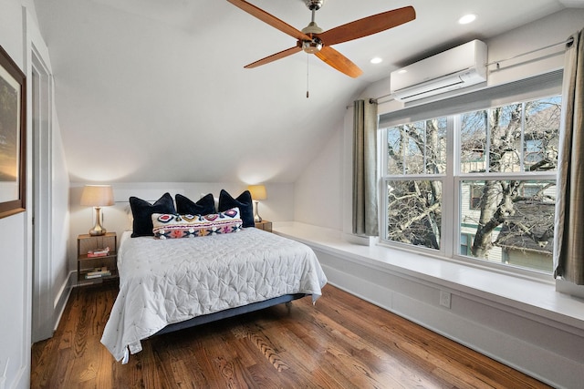 bedroom featuring ceiling fan, dark wood-type flooring, vaulted ceiling, and a wall mounted AC