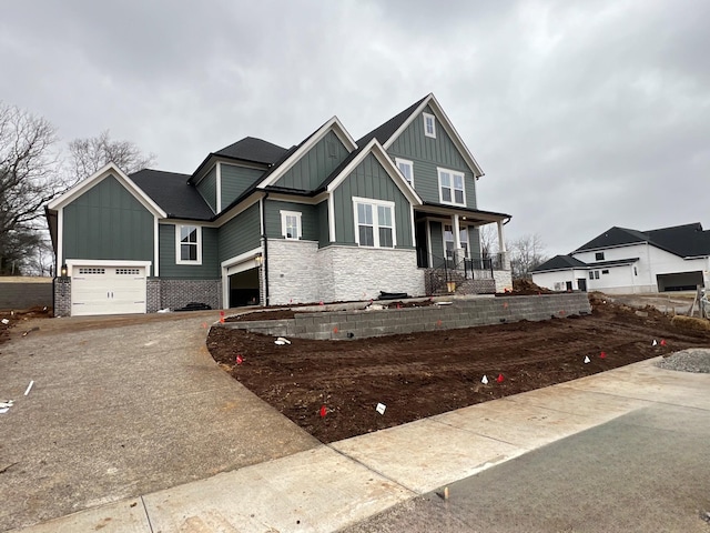 view of front of property featuring a garage and a porch