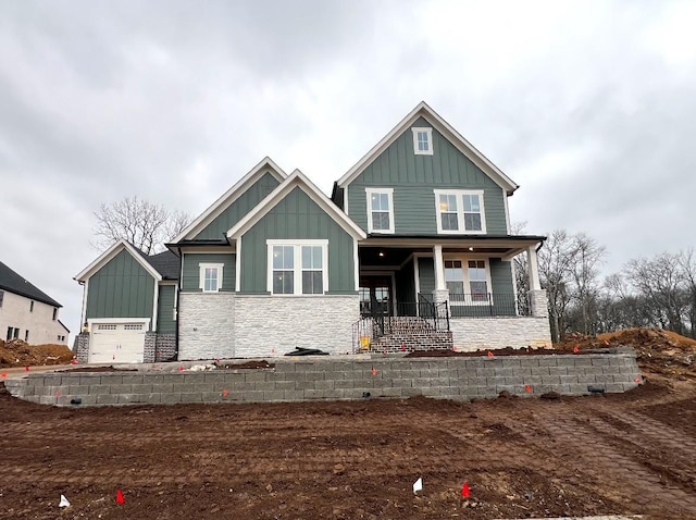 craftsman-style home featuring a garage and covered porch