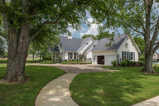 view of front facade with a garage and a front yard