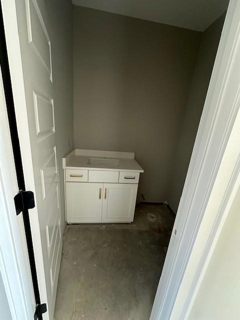 bathroom featuring concrete flooring