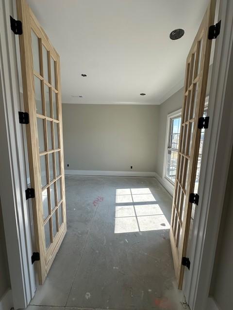 empty room featuring french doors