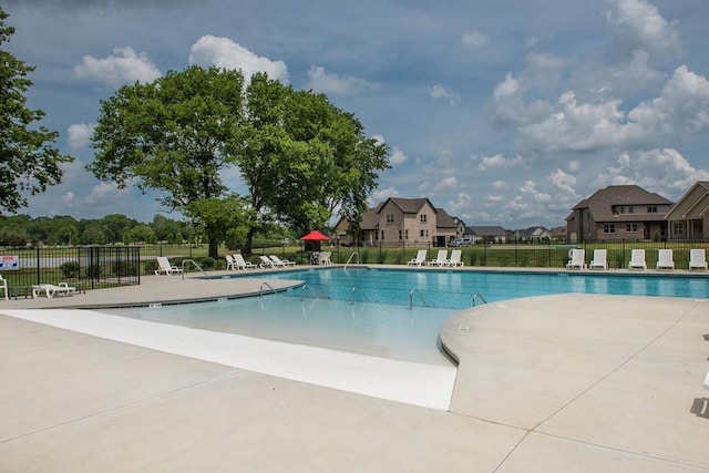 view of swimming pool with a patio