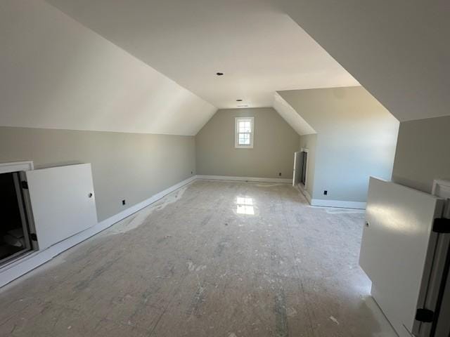 bonus room featuring vaulted ceiling